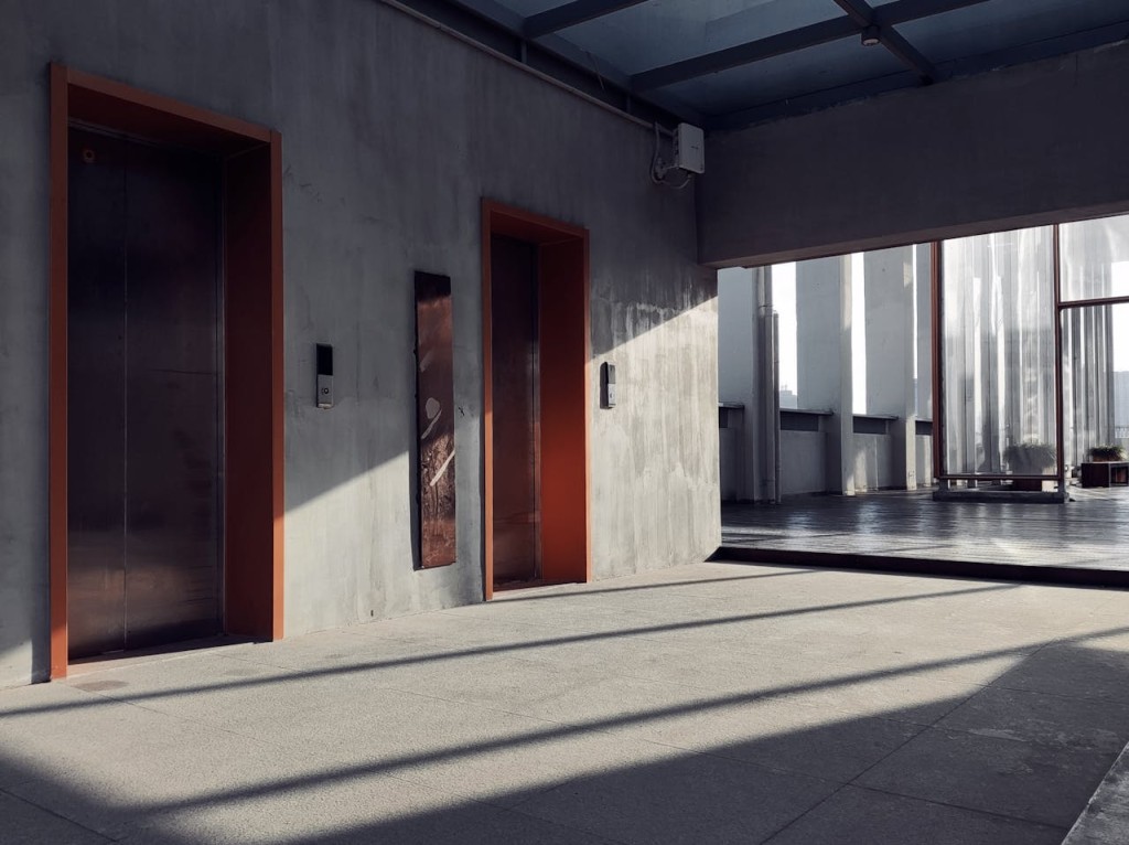 Shadows and Sunlight on Wall with Elevators